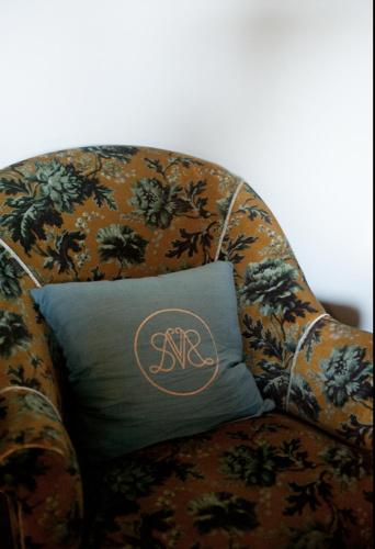 a pillow sitting on top of a chair at Villa Servais in Halle