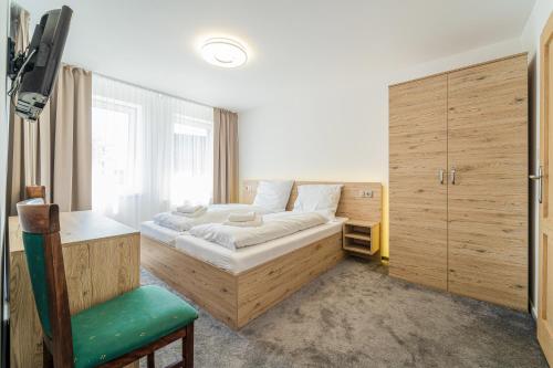 Ένα ή περισσότερα κρεβάτια σε δωμάτιο στο Penzión Čikovský