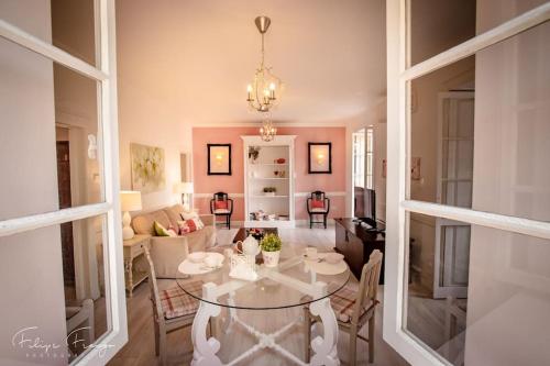 a living room with a table and a couch at Private Pool Apt. with Great View in Funchal
