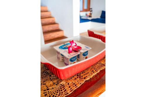 a box with a bow is sitting in a tray at Casa Canoa Camocim in Camocim
