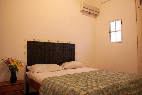 a bedroom with a bed and a window at IDEAL SOCIAL Hostel in Buenos Aires