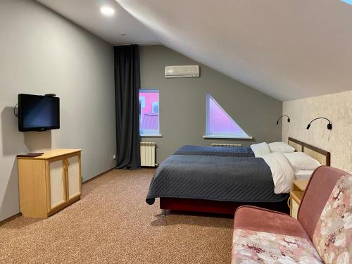 Кровать или кровати в номере Отель Уют