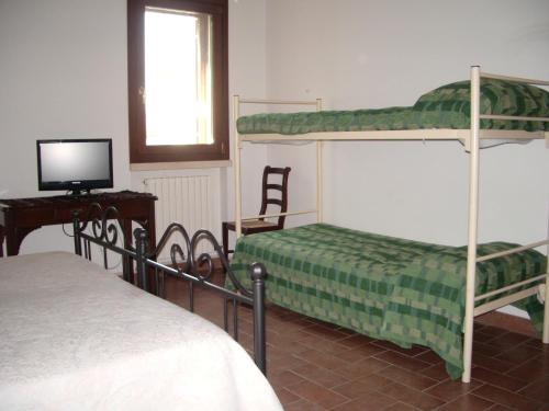 Кровать или кровати в номере Agriturismo Antica Corte Cason