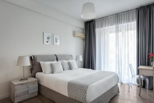 Posteľ alebo postele v izbe v ubytovaní Syntagma Spotlight Residence