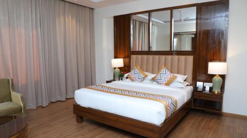 מיטה או מיטות בחדר ב-OAKTREE HOTEL