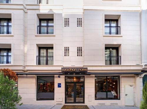 a facade of a white building with a boutique hotel at Suadhan Hotel in Istanbul