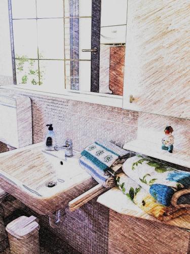 a bathroom with a sink and a mirror at Agriturismo bio Verde Armonia in Montemarciano