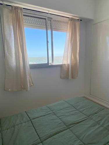 Giường trong phòng chung tại Quinto al mar