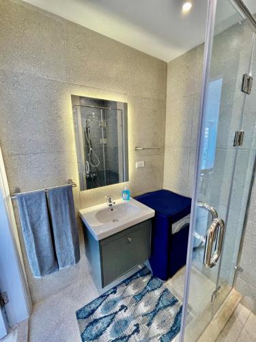 a bathroom with a sink and a shower at Sea View Paradise in Alexandria