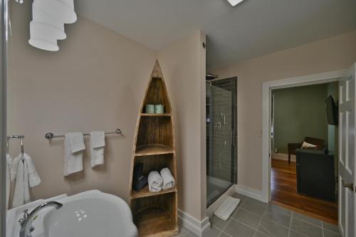 a bathroom with a toilet and a sink and a shower at Tom Quick Inn in Milford