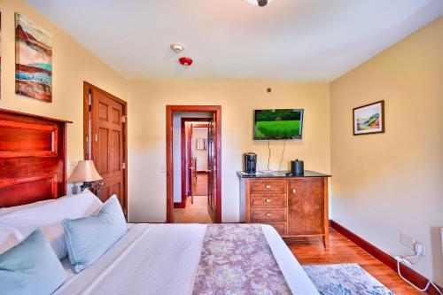a bedroom with a bed and a dresser in it at Tom Quick Inn in Milford