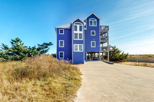 a blue house on the side of a road at Alelleo's Retreat #13-S in Salvo