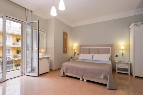 Ένα ή περισσότερα κρεβάτια σε δωμάτιο στο Victoria Palace Hotel & Zen Wellness
