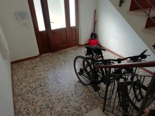 a bike parked in a room with a floor at Camera La Margherita in San Quirico dʼOrcia