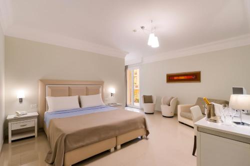 Ένα ή περισσότερα κρεβάτια σε δωμάτιο στο Victoria Palace Hotel & Zen Wellness