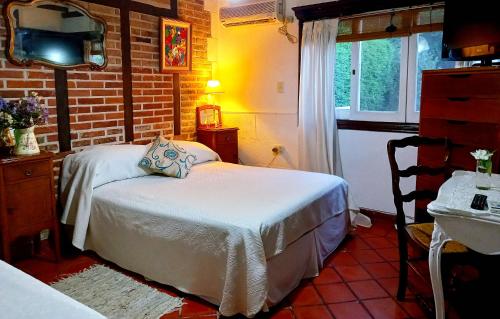 A bed or beds in a room at Los Azahares de Tigre