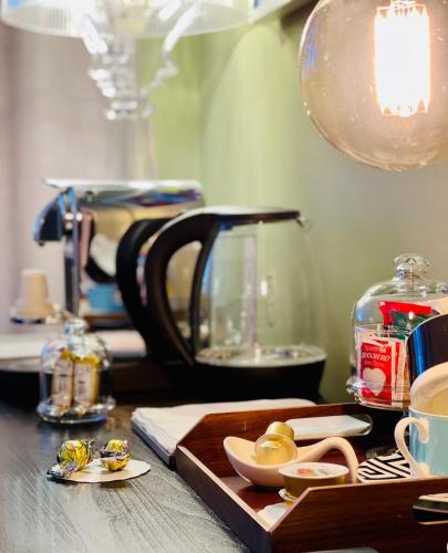 a table with a tea kettle and plates of food at Palazzina300 in Treviso