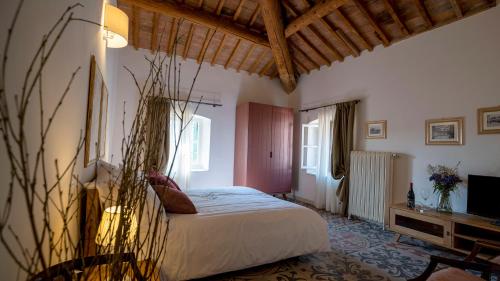 Postel nebo postele na pokoji v ubytování Locanda Dell'Oleificio