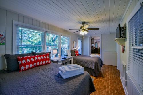 a bedroom with two beds and a ceiling fan at Sherwood House in Tuscaloosa