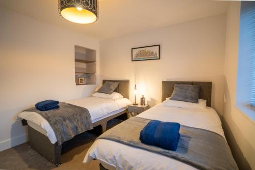 Katil atau katil-katil dalam bilik di Mill Road Apartment First Floor