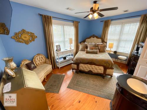 a bedroom with a bed and a couch at Bama Bed and Breakfast - Chimes Suite in Tuscaloosa