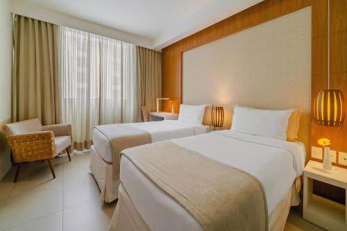 Katil atau katil-katil dalam bilik di Matiz Niterói Design Hotel