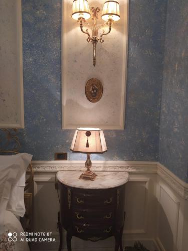 a lamp sitting on a table in a room at Luxury B&B IL Sogno in Cerignola