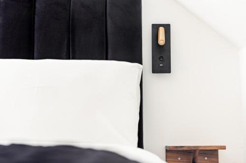 Ένα ή περισσότερα κρεβάτια σε δωμάτιο στο Cambridge House Hotel