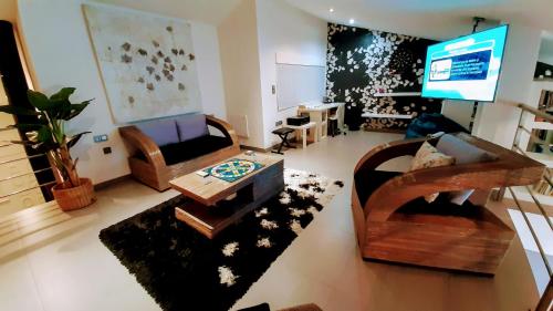 a living room with a couch and a table at Home VIP - Vivienda de Lujo con todo detalle in Casas Ibáñez