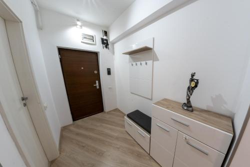 a room with a hallway with a door at Parliament 200sqm Loft Style 1BR AP w private garden in Bucharest