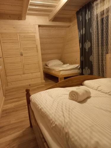 Katil atau katil-katil dalam bilik di Domki Widokowe Panorama Tatr