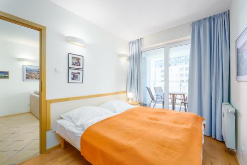 Posteľ alebo postele v izbe v ubytovaní APT Nadmorskie - Portowe