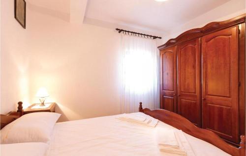 Postel nebo postele na pokoji v ubytování Apartment Frankovici Stara Vala - Tinjan Istra
