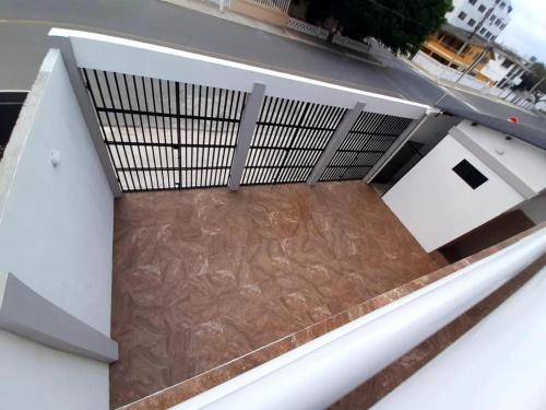 a balcony of a building with a wooden floor at Suites del Pacífico in Salinas