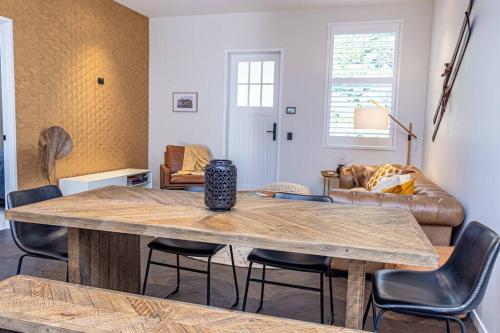 a living room with a table and a couch at Rata Boutique Apartments in Ohakune