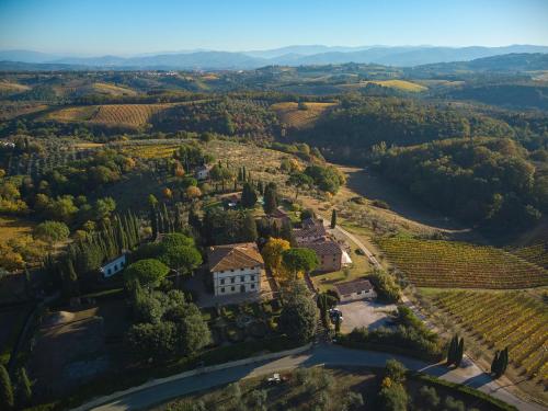 an aerial view of a mansion in a vineyard at Fattoria La Loggia in San Casciano in Val di Pesa