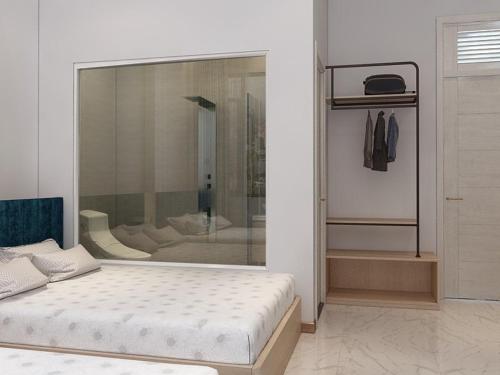 Postel nebo postele na pokoji v ubytování Thiên Thanh Hotel