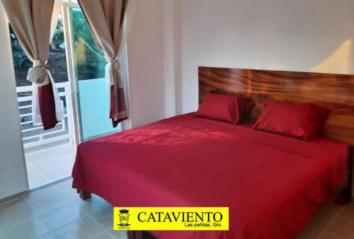 Katil atau katil-katil dalam bilik di Cataviento Hotel