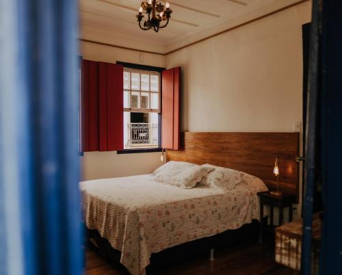 Tempat tidur dalam kamar di Pousada Casa do Pilar