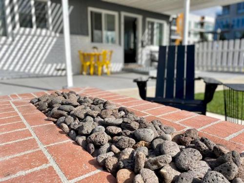 a pile of cookies on top of a brick wall at Steps To The Beach, Pacific City and Main Street - #5 in Huntington Beach