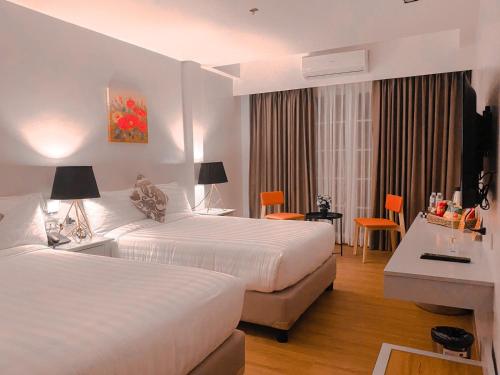 En eller flere senge i et værelse på Via Appia Tagaytay