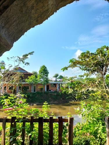 a house in the middle of a village at FOREST BREATH ECO-LODGE in Tân Phú