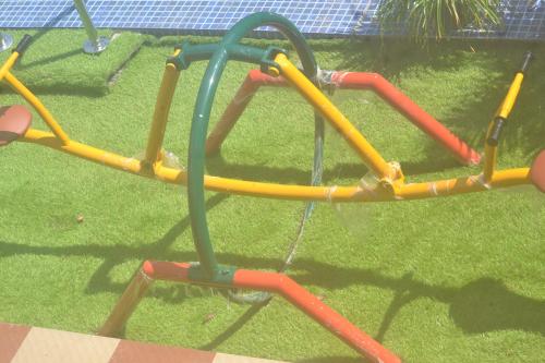 a childs play equipment in a playground at Arabian Nights Munnar Pool Villa in Munnar