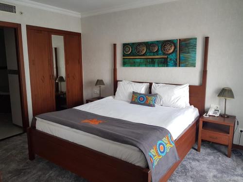 Postel nebo postele na pokoji v ubytování Midas Hotel