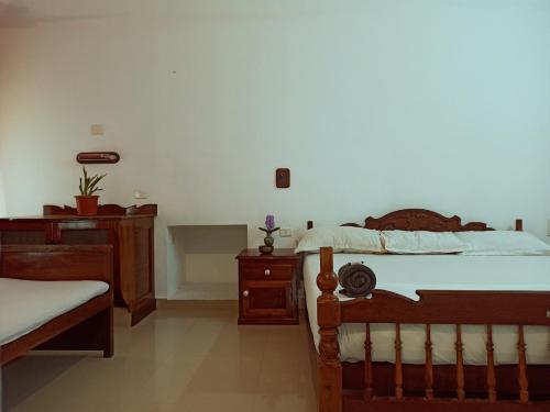 Una cama o camas en una habitación de RiTAS