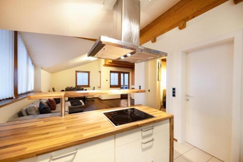 a kitchen with a stove top oven in a room at Apartement Huck in Cornedo all'Isarco