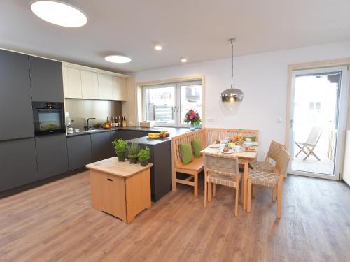 a kitchen and dining room with a table and chairs at Ferienhaus Birkenweg Oberstdorf in Oberstdorf