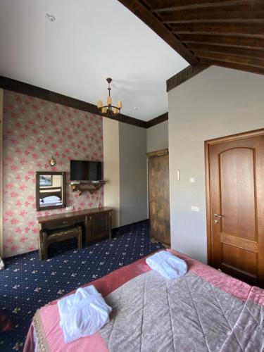 Cama o camas de una habitación en Шале Bellmont