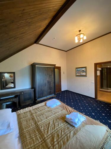 Cama o camas de una habitación en Шале Bellmont