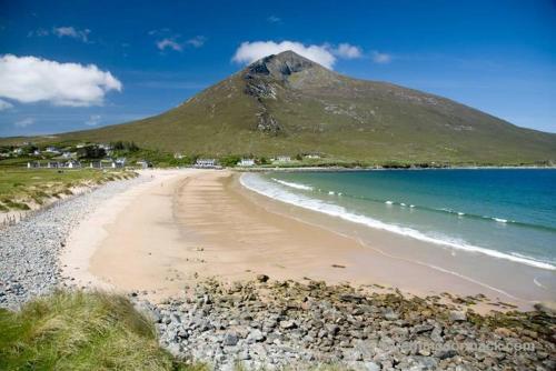 a beach with a mountain in the background at Monastery View in Bunacurry